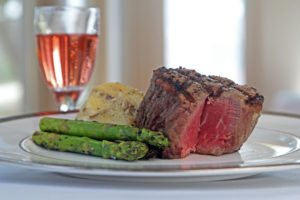 steak dinner with mashed potatoes and asparagus