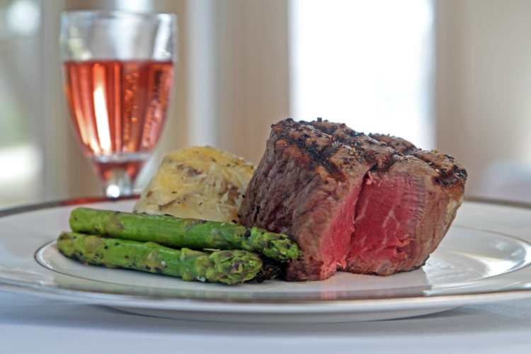 steak dinner with mashed potatoes and asparagus