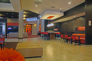 empty hotel lounge with orange decor