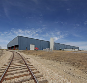 exterior shot of commercial building with railroad loading access