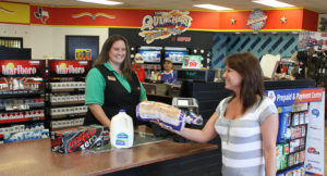 CEFCO convenience store cashier with customer