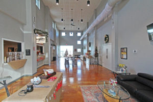 office lounge area with tall ceilings cafe and seating