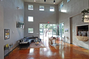 office lounge with tall ceilings and coffee bar