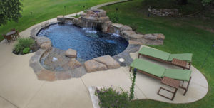birds eye view of backyard pool with waterfall feature