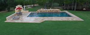 backyard pool in wooded yard