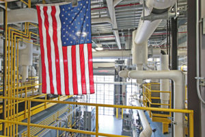American flag flying inside factory