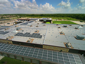 roof of commercial building showing HVAC and solar panels