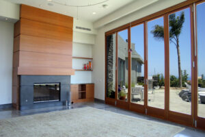 living room looking out back door windows to swimming pool