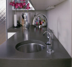 closeup of stained concrete kitchen sink