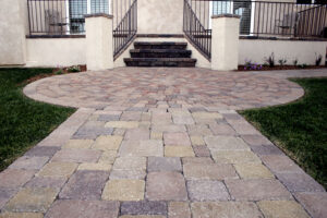 paved stone walkway leading to house